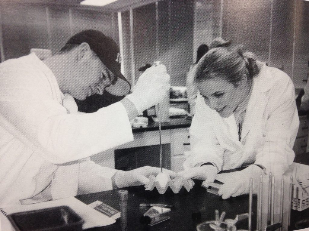 Photo of two students in 1997 working together on a science project.