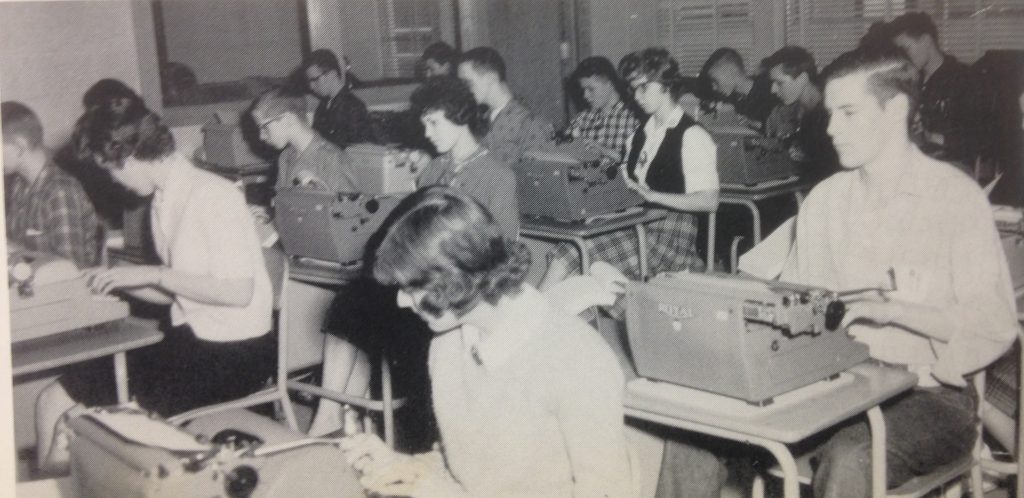 Photos of students in 1958 using typewriters.