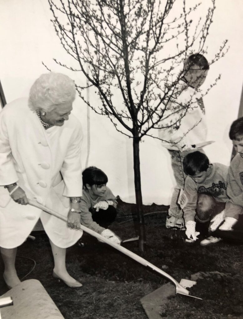 First Lady Barbara Bush planting a tree with students from Prairie View Elementary School.